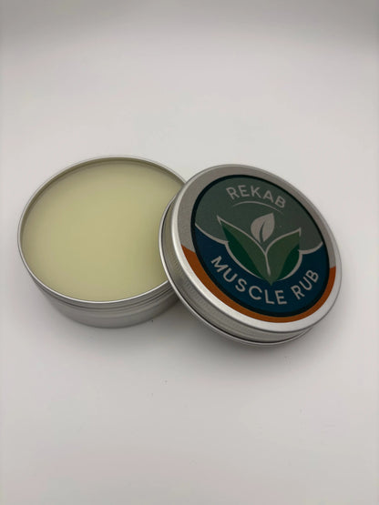 Metal tin of REKAB Muscle Rub with open lid on a white background