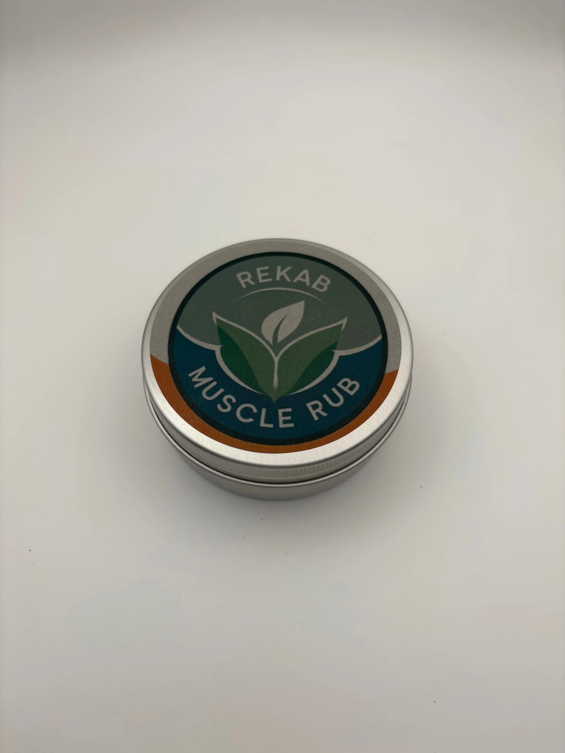 Tin of REKAB Muscle Rub on a white background